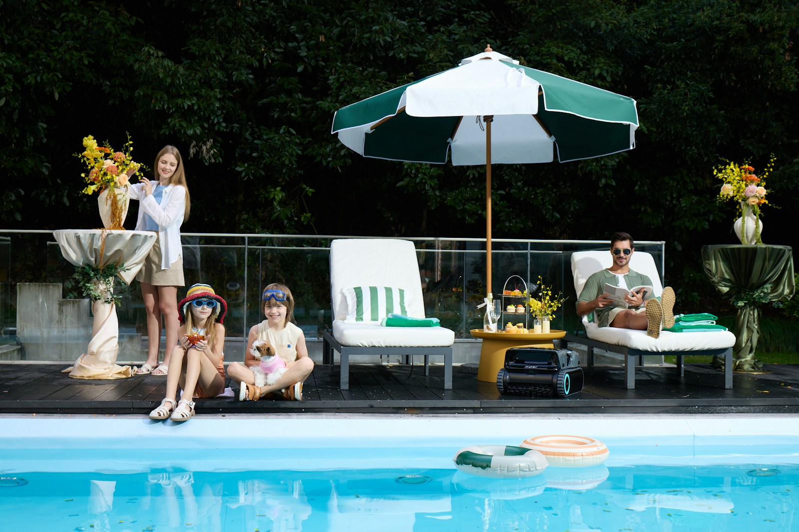Family relaxing by a swimming pool on a sunny day.