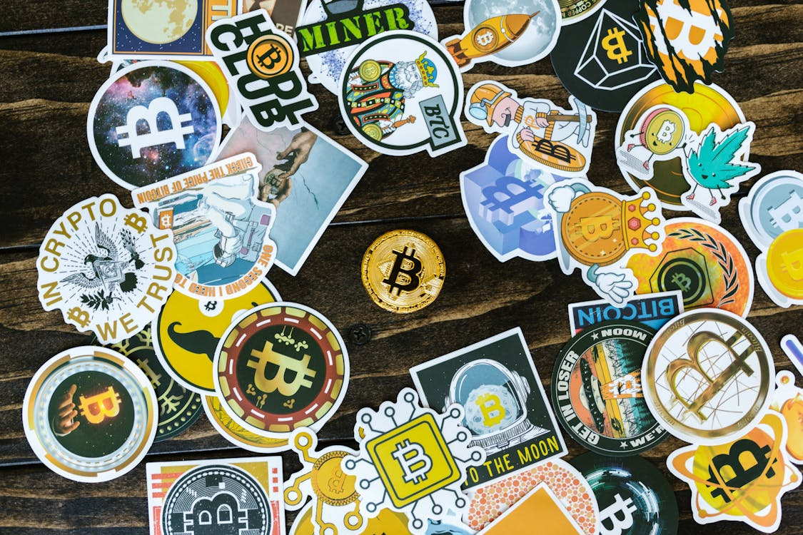 Assorted Bitcoin stickers, NFTs and digital assets