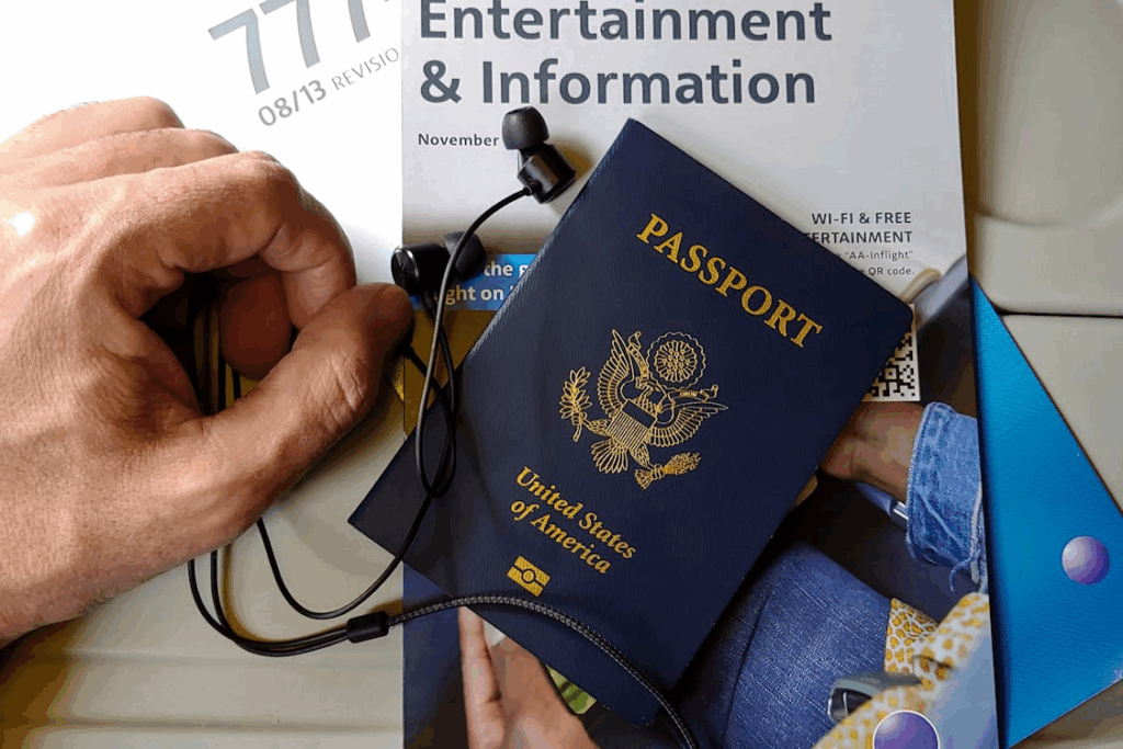 U.S. passport on an airplane seat with travel documents