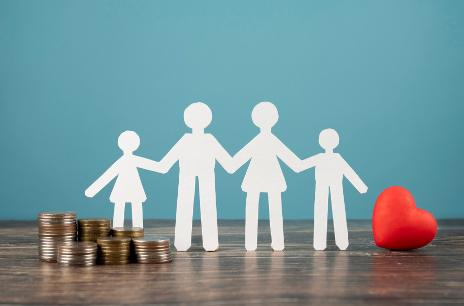 Paper cut-out family with stacks of coins - a symbol of preserving family wealth and legacy.