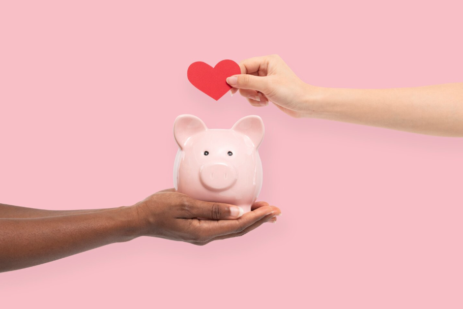 Hands holding a piggy bank with a paper heart, aligning money with values